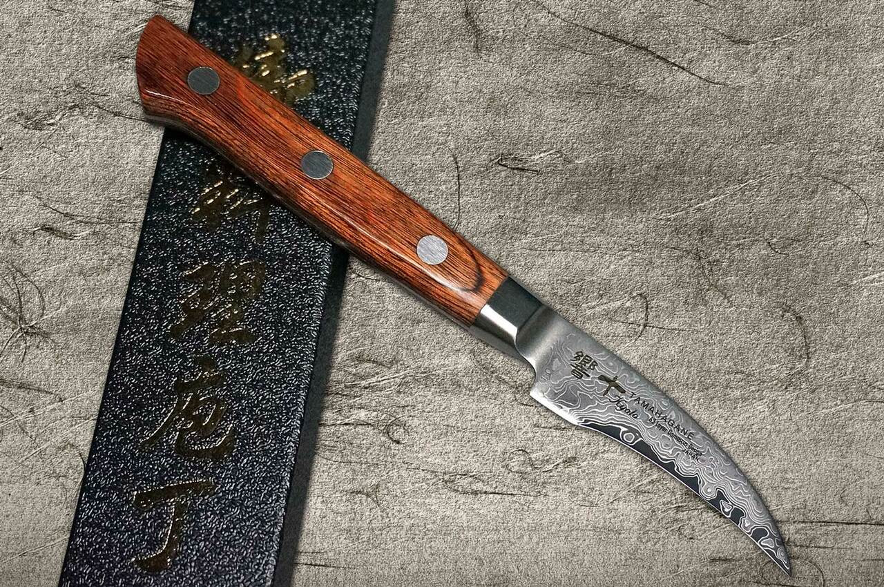 https://cdn11.bigcommerce.com/s-attnwxa/images/stencil/1280x1280/products/1931/182078/tamahagane-tamahagane-kyoto-63-layer-damascus-wood-handle-japanese-chefs-peeling-knife-70mm__34917.1632913434.jpg?c=2