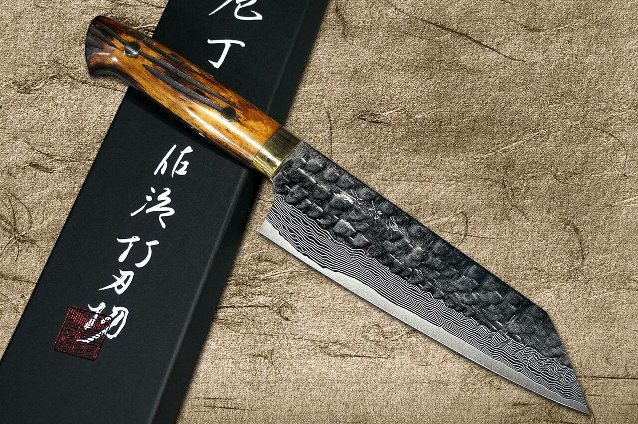 https://cdn11.bigcommerce.com/s-attnwxa/images/stencil/1280x1280/products/4319/164607/takeshi-saji-takeshi-saji-vg10-mirror-hammered-damascus-dhm-japanese-chefs-bunka-knife-180mm-with-brown-antler-handle__97797.1624948994.jpg?c=2