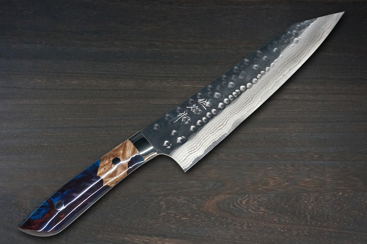 https://cdn11.bigcommerce.com/s-attnwxa/images/stencil/1280x1280/products/4740/190504/takeshi-saji-srs13-mirror-hammered-damascus-stw-japanese-chefs-gyuto-knife-210mm-galaxy-purple-stabilized-hybrid-resin-handle__11473.1642847916.jpg?c=2