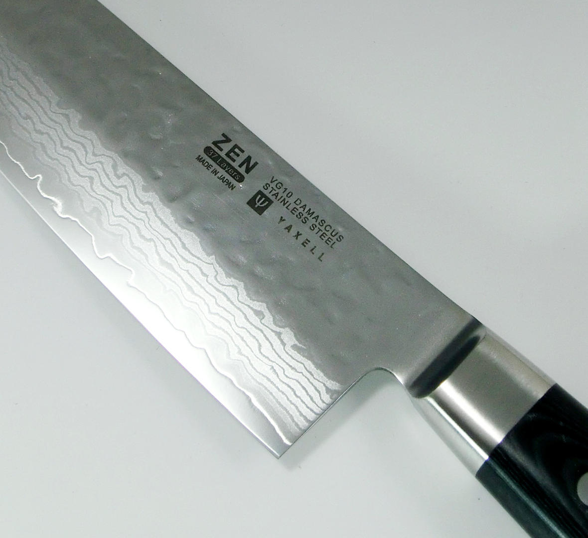 https://cdn11.bigcommerce.com/s-attnwxa/images/stencil/original/products/103/186052/yaxell-yaxell-zen-37-layer-vg10-damascus-hammered-japanese-chefs-gyuto-knife-200mm__99026.1635509444.jpg?c=2&imbypass=on&imbypass=on