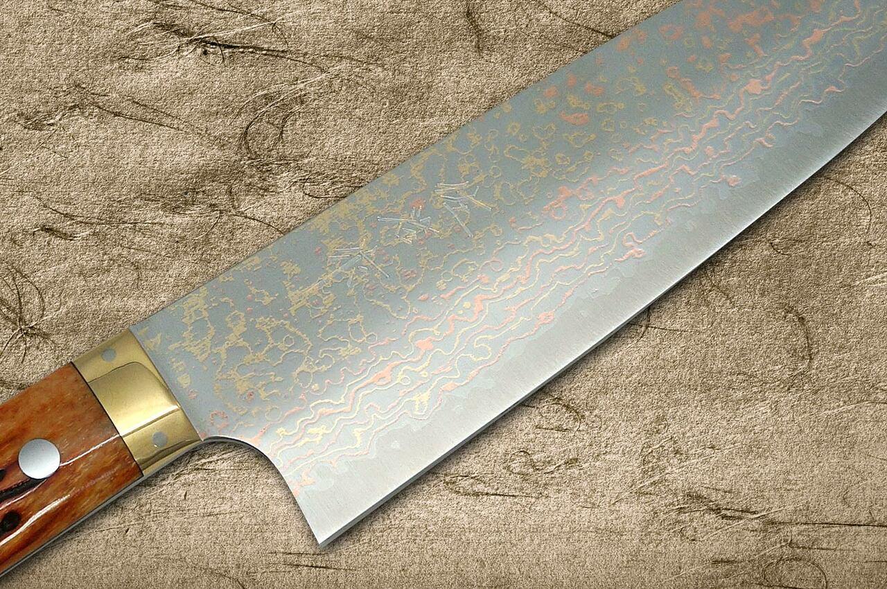 https://cdn11.bigcommerce.com/s-attnwxa/images/stencil/original/products/4868/196532/takeshi-saji-vg10-colored-damascus-dho-japanese-chefs-santoku-knife-180mm-with-orange-antler-handle__98308.1651415080.jpg?c=2&imbypass=on&imbypass=on