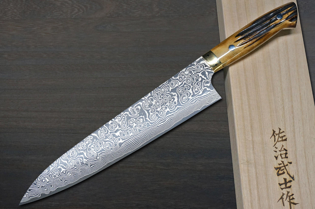 https://cdn11.bigcommerce.com/s-attnwxa/images/stencil/original/products/5601/218643/takeshi-saji-r2sg2-black-damascus-dhm-japanese-chefs-gyuto-knife-240mm-with-brown-antler-handle__31916.1673128178.jpg?c=2&imbypass=on&imbypass=on