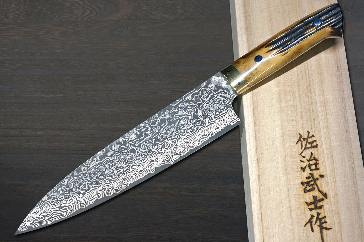 https://cdn11.bigcommerce.com/s-attnwxa/images/stencil/original/products/5602/218711/takeshi-saji-r2sg2-black-damascus-dhm-japanese-chefs-gyuto-knife-210mm-with-brown-antler-handle__24055.1673128250.jpg?c=2&imbypass=on&imbypass=on