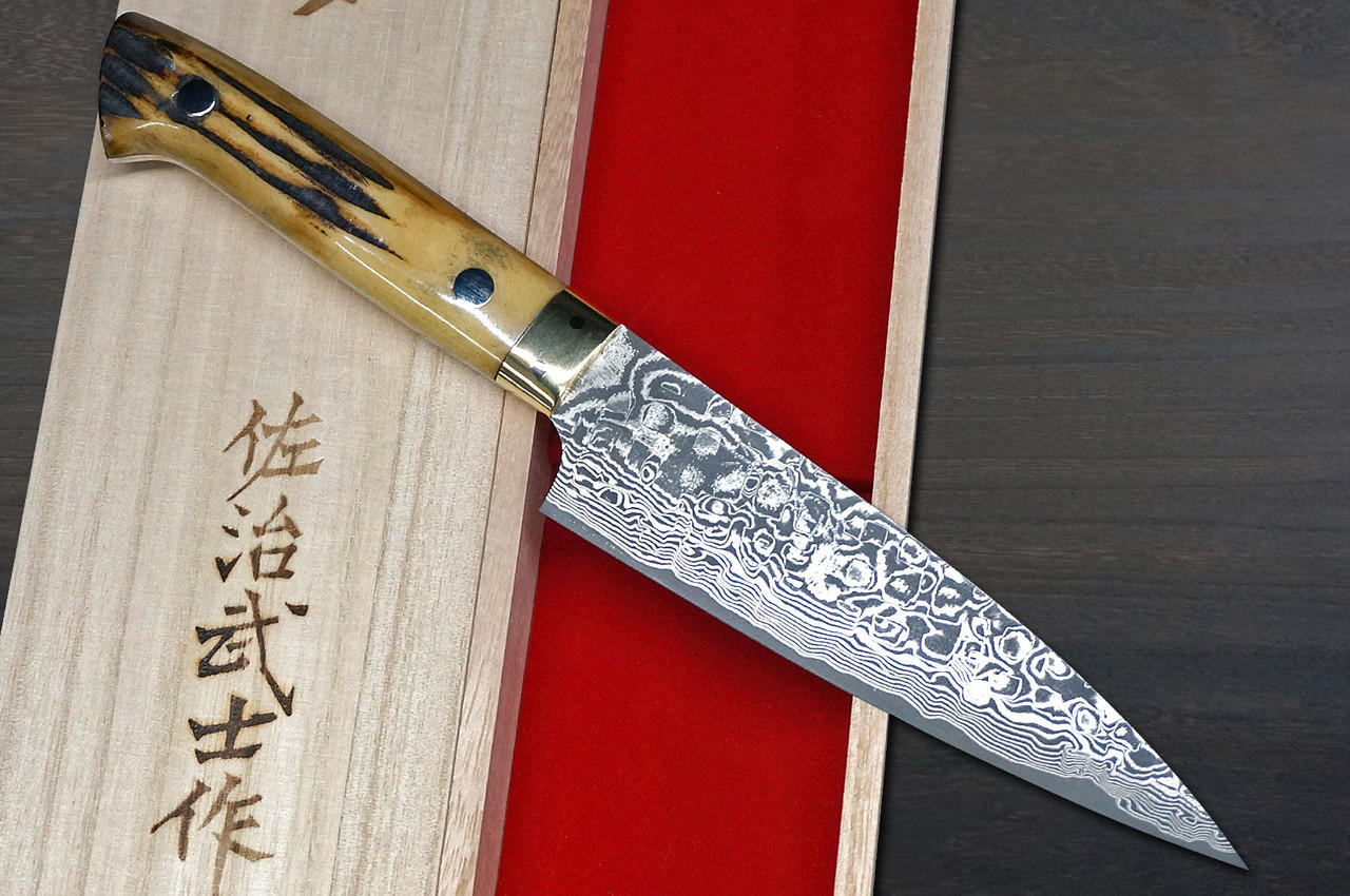 https://cdn11.bigcommerce.com/s-attnwxa/images/stencil/original/products/5608/218721/takeshi-saji-r2sg2-black-damascus-dhm-japanese-chefs-petty-knifeutility-130mm-with-brown-antler-handle__38783.1673128261.jpg?c=2