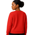 She wearing a poppy red recycled sweatshirt in a relaxed fit, viewed from the back.
