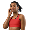 Front view of the Anuri Kinetic Racerback Sports Bra in Poppy Red featuring a scoop neckline and black contrast athletic binding.