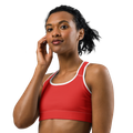 Front view of the Anuri Kinetic Racerback Sports Bra in Poppy Red displaying the double-layered front panel and white contrast trim.