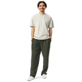 Male athlete wearing Anuri Flow Earth Men’s Wide-Leg Recycled Joggers in olive green.