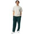 Male model wearing Anuri Ignite Power Men’s Wide-Leg Recycled Joggers in bold teal green.