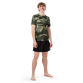athlete wearing the Anuri Flow Earth Men's Recycled Rash Guard in a green forest camouflage pattern.