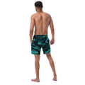 Back view of an athletic male model highlighting the tailored fit and elastic waistband of the Anuri Ignite Men's Recycled Swim Trunks in teal camo.