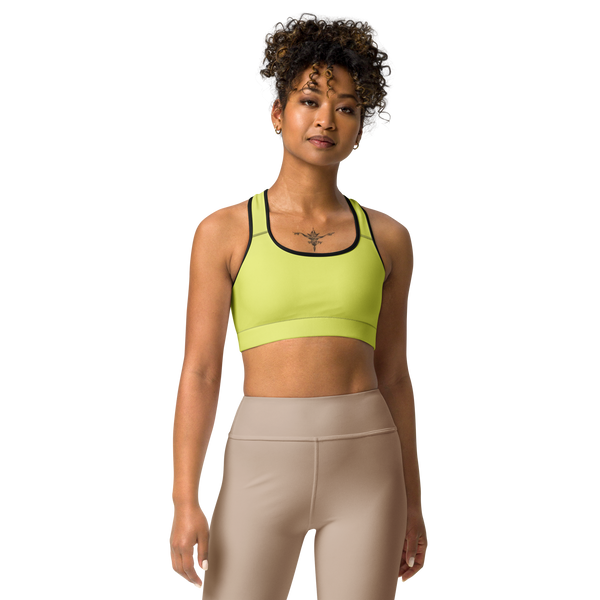 Front view of the Anuri Kinetic Racerback Sports Bra in Lemon Grass featuring a scoop neckline and black contrast athletic binding.
