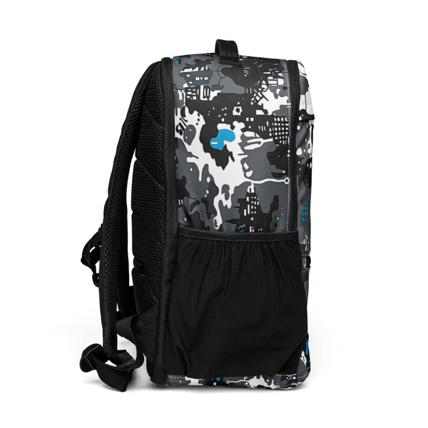 an urban utility backpack featuring an urban camouflage design in black, gray, white, and blue. The backpack has multiple zippered compartments and a side mesh pocket.