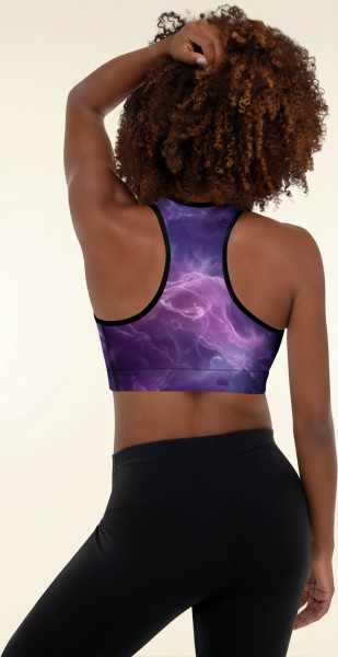Back view of a model wearing the Anuri Flow Padded Sports Bra in a cosmic purple abstract print highlighting the ergonomic athletic racerback design and black binding.
