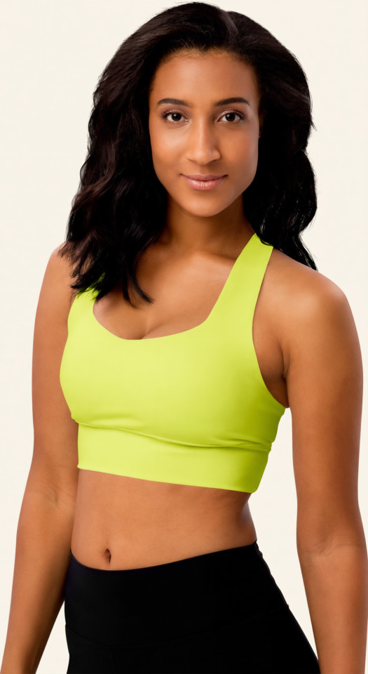 Left front view of the Anuri EcoForm Recycled Longline Sports Bra in Primrose Pink, featuring a modern scoop neckline and a supportive, structured crop silhouette.