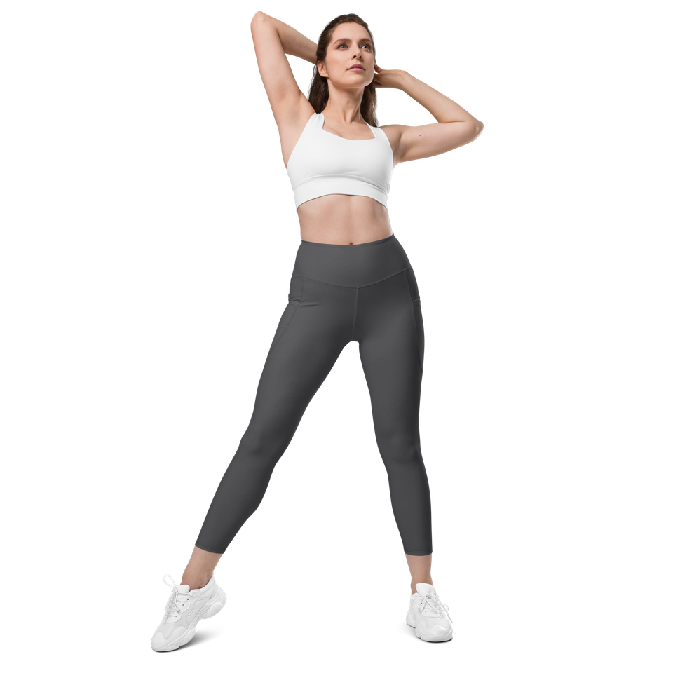 Sustainable Core-Pocket women's dark gray leggings, made from recycled materials, offering mild compression, a flattering high-waist, and convenient side pockets for active use