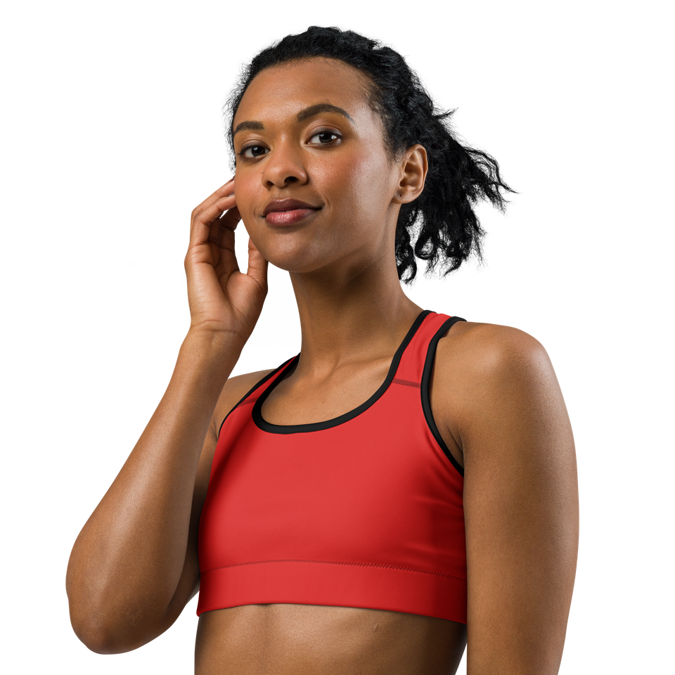 Front view of the Anuri Kinetic Racerback Sports Bra in Poppy Red featuring a scoop neckline and black contrast athletic binding.