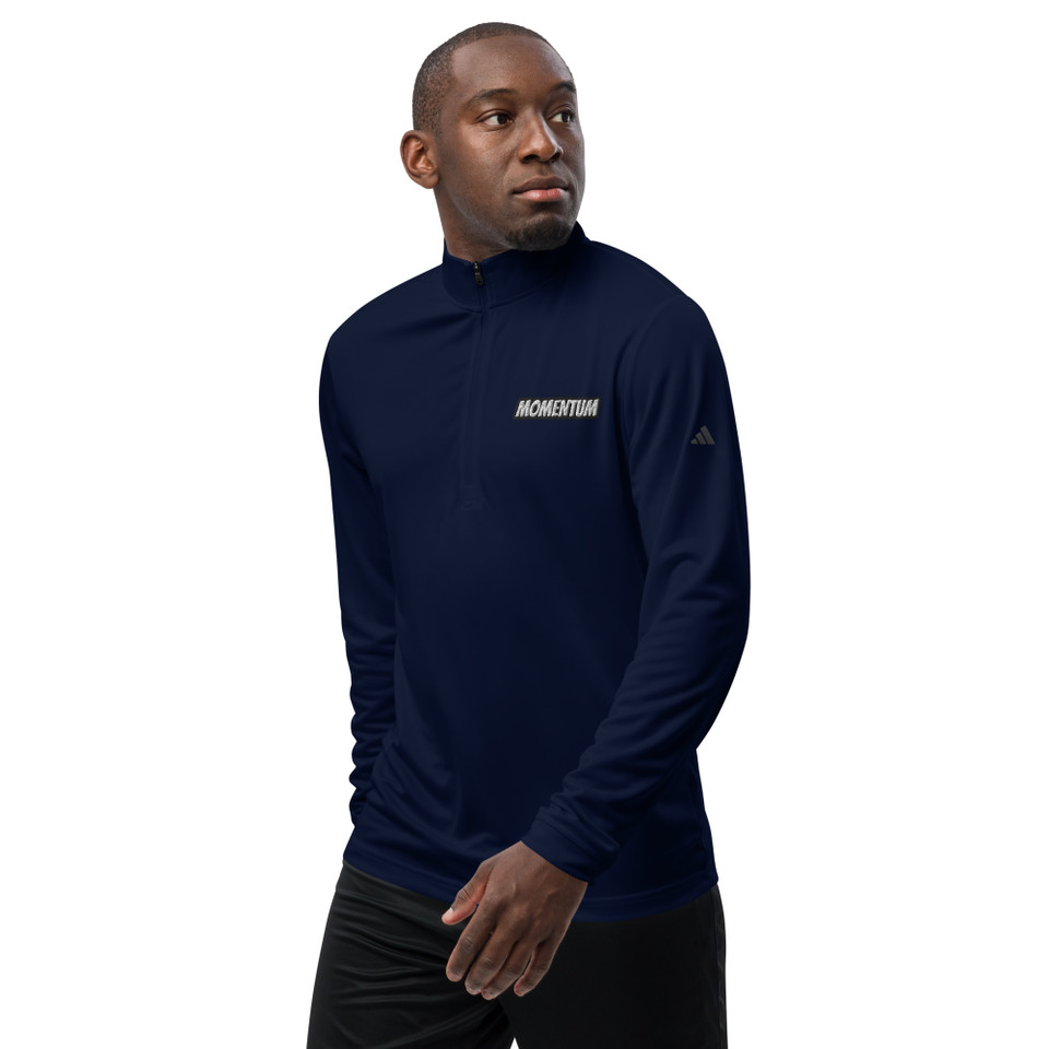 Model wearing collegiate navy Adidas quarter zip pullover with “Momentum” logo on left chest – lightweight, UPF 50+, eco-performance wear by Anuri Activewear.