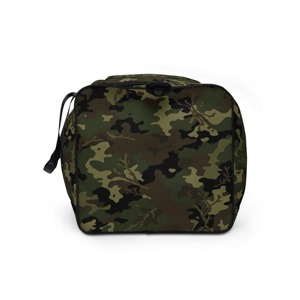 a spacious duffle bag featuring a classic green, brown, and black military camouflage pattern. It has black padded handles and a black adjustable shoulder strap.