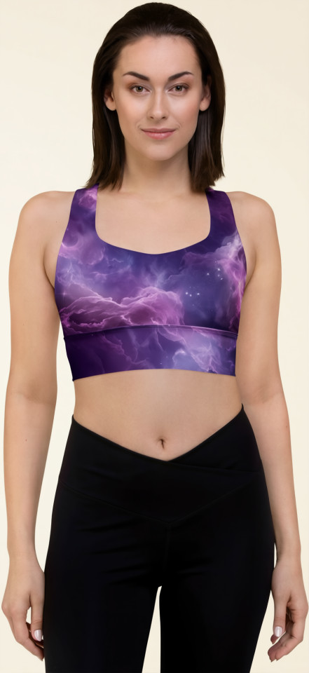 Front view of a model wearing the Anuri Flow Recycled Longline Sports Bra in a cosmic purple abstract print, highlighting the scoop neckline and structured crop silhouette.