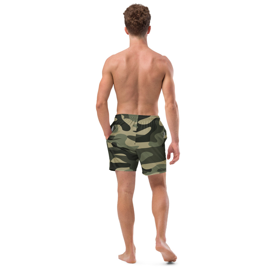 Back view of an athletic male model highlighting the tailored fit and elastic waistband of the Anuri Flow Men's Recycled Swim Trunks in green camo.