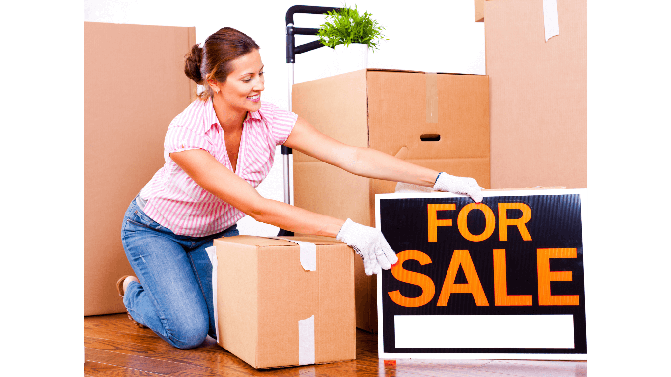 house-for-sale-woman-packing-cigarette-odor-removal.png