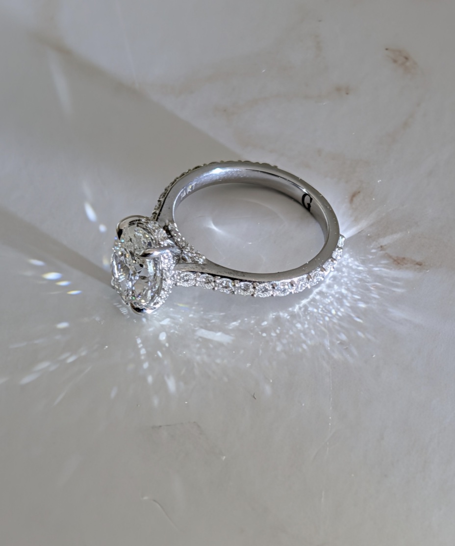 Diamond engagement ring casting reflected light