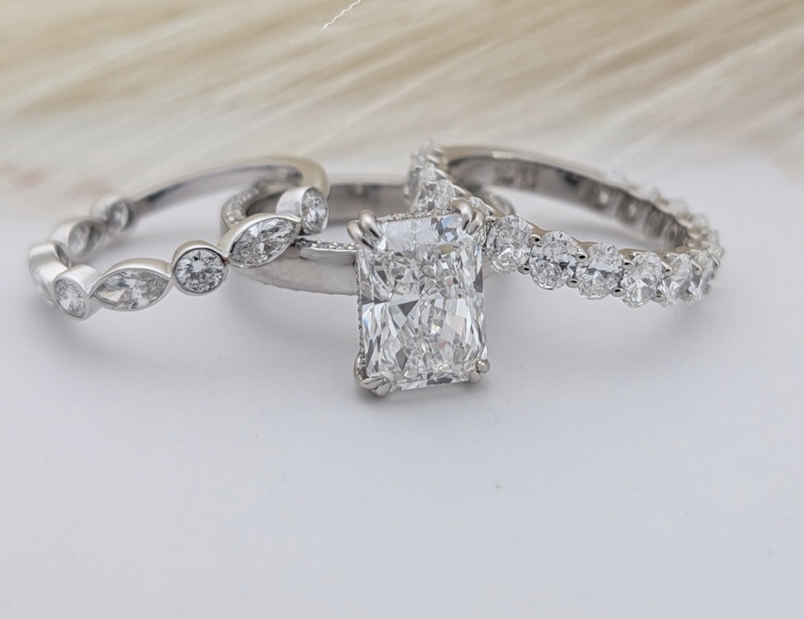 Radiant diamond engagement ring with wedding bands