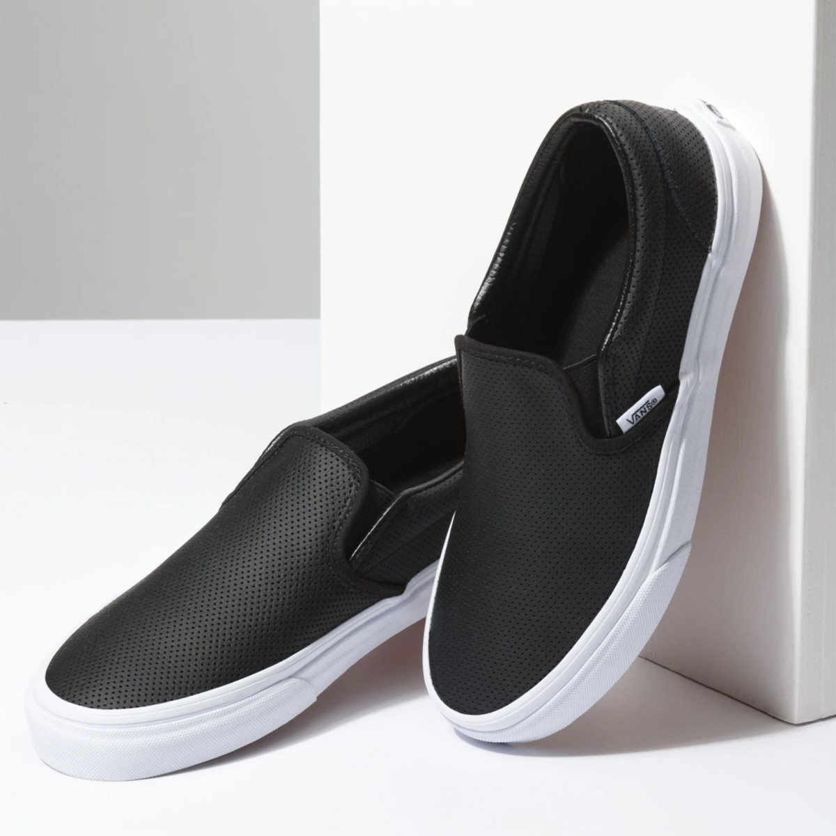 black leather van slip ons