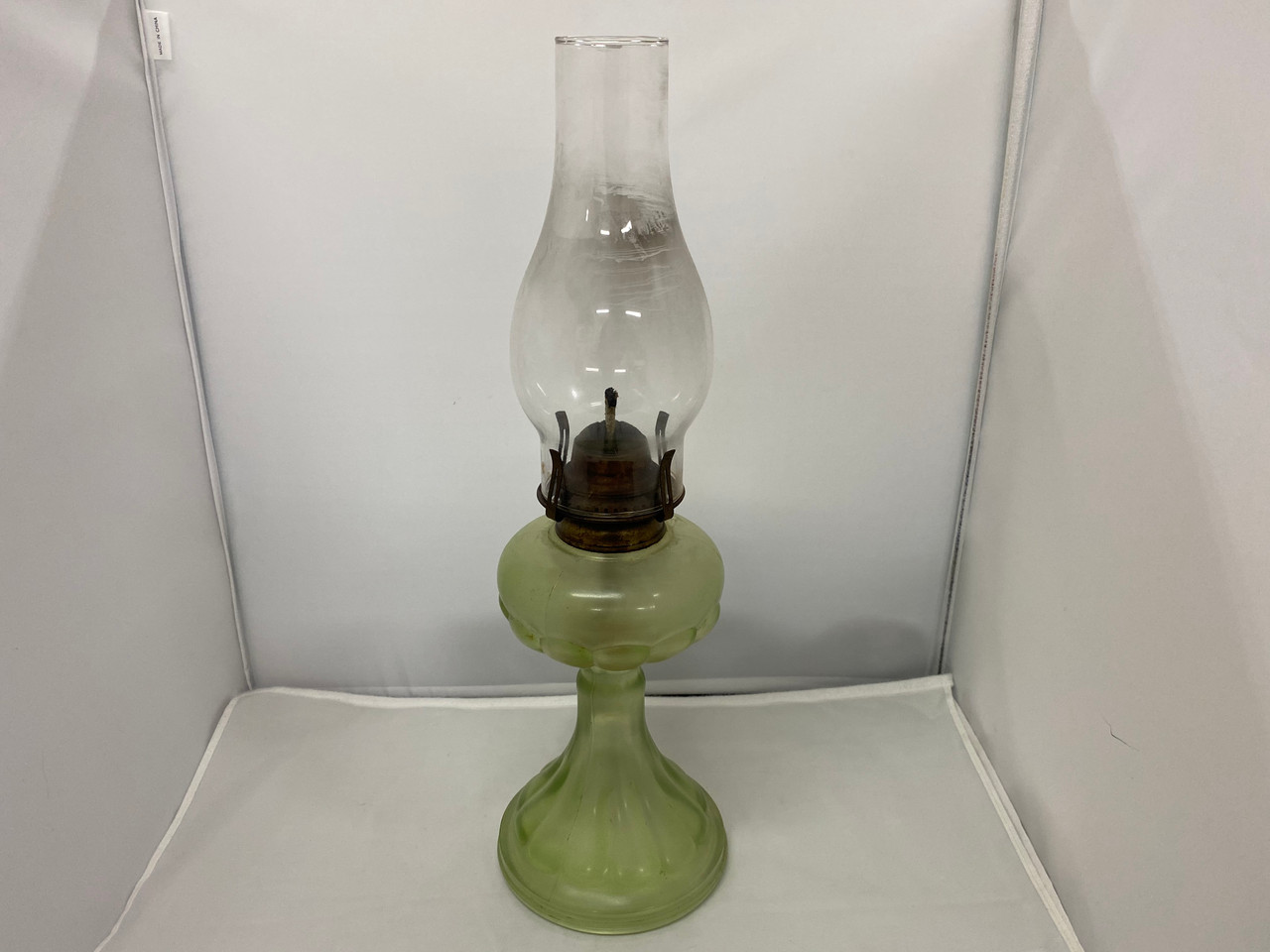 Vintage green shop oil lamp