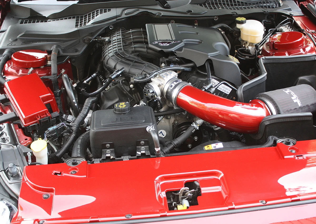 Side view of J&L Oil Separator 3.0, Passenger Side (2011-2017 Ford Mustang 3.7L V6) kit in car engine bay.