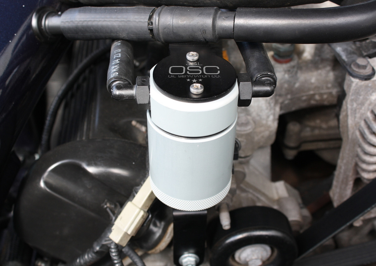 Close-up view of J&L Oil Separator 3.0, Passenger Side (1999-2004 Ford Mustang GT; 2001 Ford Mustang Bullitt) kit in engine bay.