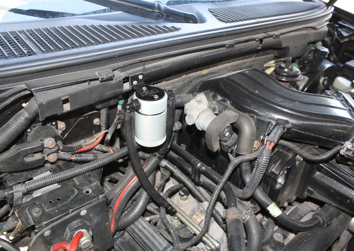 J&L Oil Separator 3.0 Passenger Side (1999-2004 Ford F-150 Lightning; 2002-2003 F-150 Harley Davidson) kit fully installed in truck engine bay.
