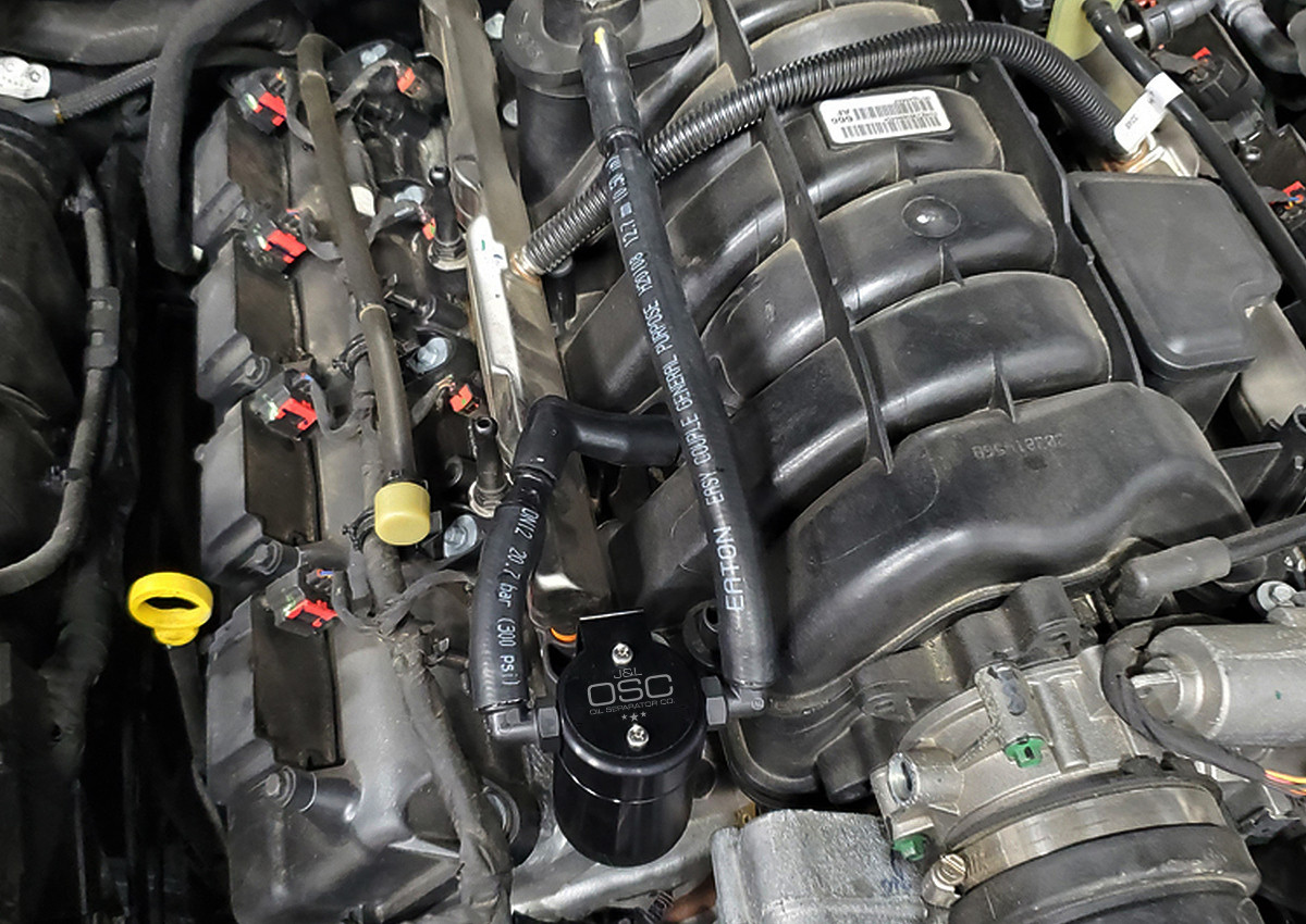 J&L Oil Separator 3.0 Passenger Side (2005-2023 5.7L Hemi Dodge Charger, Challenger, 300C & Magnum) installed kit in engine bay.