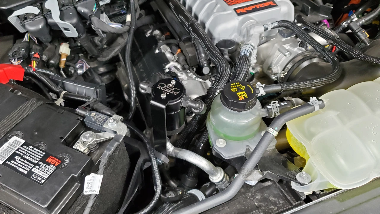 J&L Oil Separator 3.0 Passenger Side (2023-2025 Ford F150 Raptor R) unit mounted in truck engine compartment.