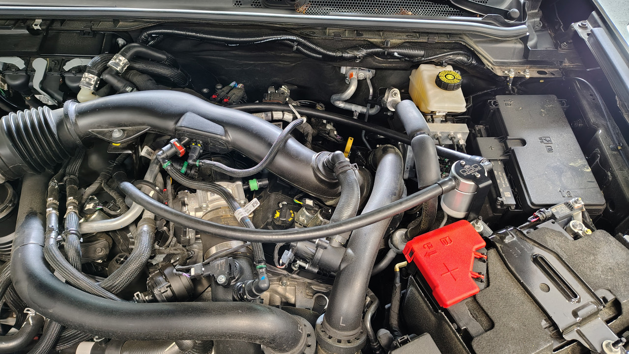 J&L Oil Separator 3.0 PCV Side (2024-2025 Ford Ranger Raptor 3.0L)  kit fully installed in truck engine bay.