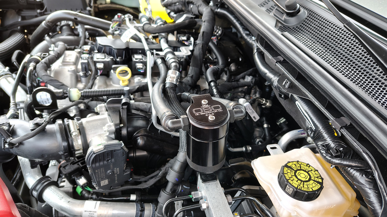 J&L Oil Separator 3.0 PCV Side (2025 Ford Bronco 2.3L; 2025 Ford Ranger 2.3L) unit mounted in vehicle engine compartment.