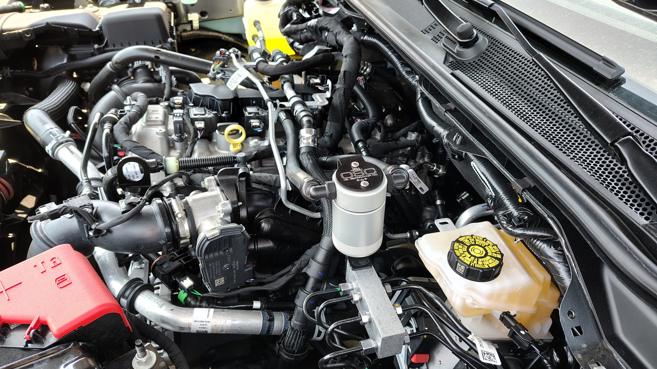J&L Oil Separator 3.0 PCV Side (2025 Ford Bronco 2.3L; 2025 Ford Ranger 2.3L)  kit fully installed in vehicle engine bay.