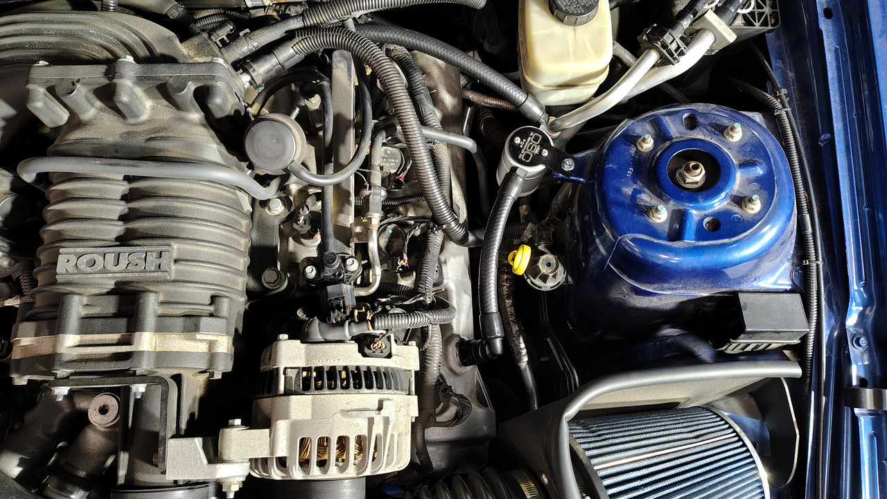 J&L oil separator mounted on a 2005-2009 Ford Mustang GT engine with a Roush M09 supercharger.