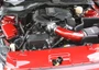 Side view of J&L Oil Separator 3.0, Passenger Side (2011-2017 Ford Mustang 3.7L V6) kit in car engine bay.