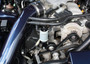 J&L Oil Separator 3.0, Passenger Side (1999-2004 Ford Mustang GT; 2001 Ford Mustang Bullitt) unit fully installed in car engine compartment.