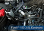 J&L Oil Separator 3.0 Passenger Side (2011-2026 F-150 - 2.7L; 3.5L EcoBoost; 2018-2021 Expedition 3.5L) kit fully installed in vehicle engine bay.