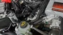 J&L Oil Separator 3.0 Passenger Side (2023-2025 Ford F150 Raptor R) kit fully installed in truck engine bay.