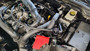 J&L Oil Separator 3.0 PCV Side (2024-2025 Ford Ranger Raptor 3.0L) unit mounted in truck engine compartment.