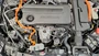 Engine bay view highlighting the clean integration of the J&L oil separator kit on a Honda hybrid engine.