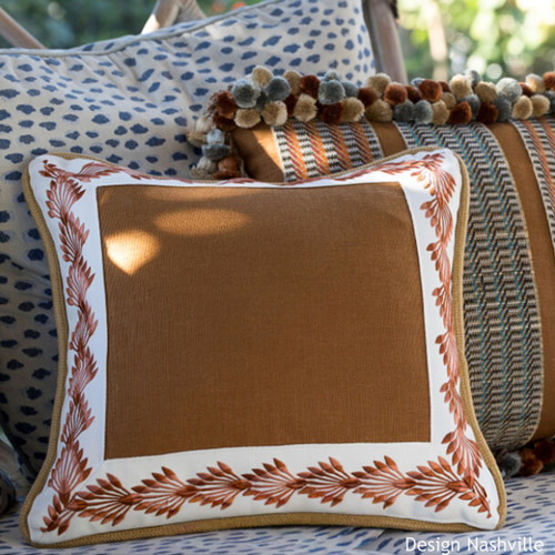 Royal palms embroidered trim on brown pillow