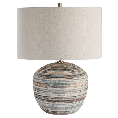 blue, brown, and white swirl around the ceramic  base of this lamp