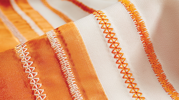 THREAD SNIPS Automatically cut top and bobbin threads, pulling thread ends to the back side of fabric