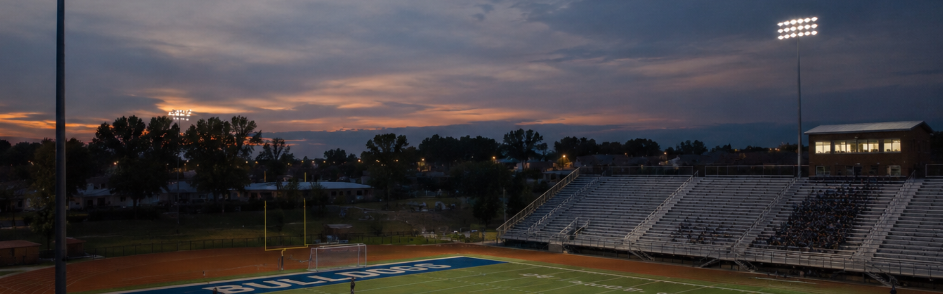 LED flood fixtures on a high-mast stadium pole replacing traditional HID lighting at a sports complex