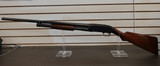 Winchester Model 12 1930 shotgun, vintage Winchester pump 12 gauge, Model 12 field grade side view, pre war Winchester shotgun, classic wood stock shotgun, Winchester 12ga